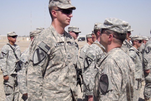 BAGHDAD-Sgt. Glenn Sewell (left), of C Troop, 6th Squadron, 9th Cavalry Regiment, 2nd Advise and Assist Brigade, 1st Infantry Division, United States Division - Center, a native of San Antonio, Tx., talks with Col. Douglas Crissman, commander of...