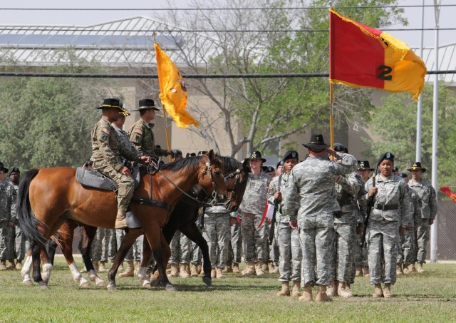 FORT HOOD, Texas - Col. John Peeler (center), commander of the 2nd Brigade Combat Team, 1st Cavalry Division, along with Soldiers from the 2nd BCT, face and salute as the 1st Cav. Div. command team as they ride past the formation during the 1st...
