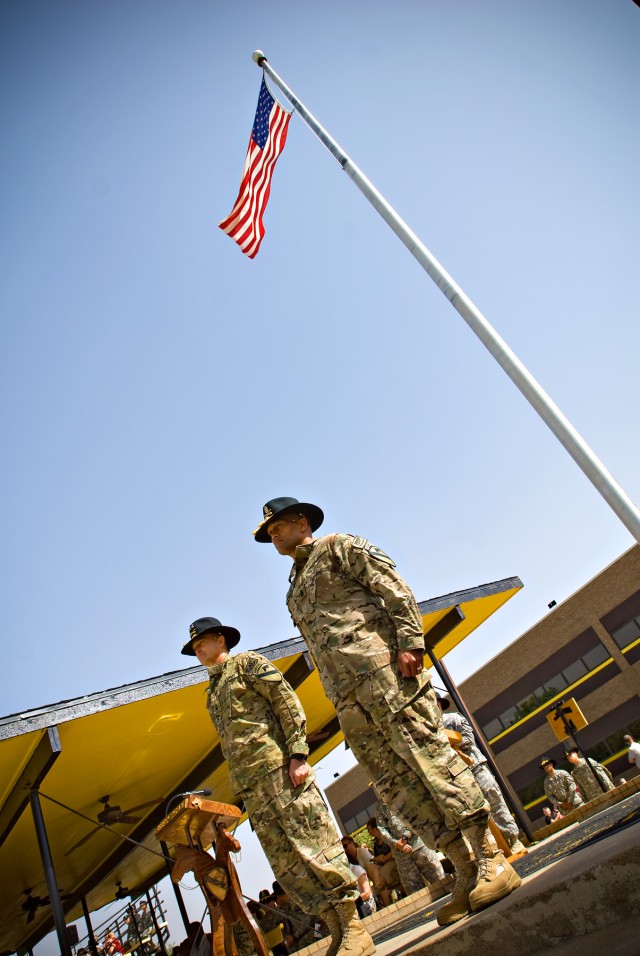 FORT HOOD, Texas- 1st Cavalry Division Commander, Maj. Gen. Daniel Allyn (left), and Sgt. Maj. Isaia Vimoto prepare to take their reigns  from the Horse Cavalry Detachment for a 'mounted inspection' of the 1st Cavalry Division troops on Fort...