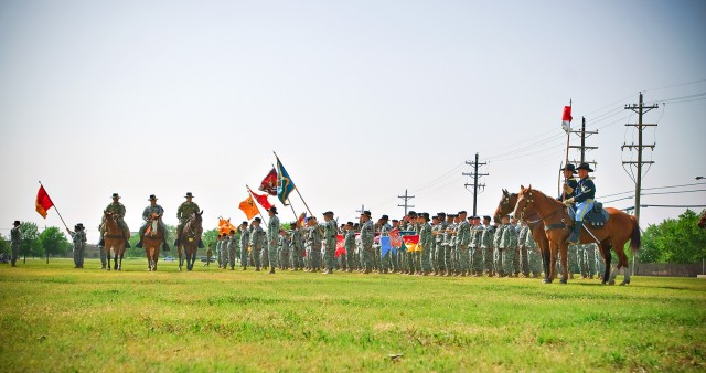 FORT HOOD, Texas- Maj. Gen. Daniel Allyn (right mounted), 1st Cavalry Division commander; outgoing Command Sgt. Maj. Rory Malloy (center mounted); and Division Command Sgt. Maj. Isaia Vimoto conduct a mounted inspection of the division's...