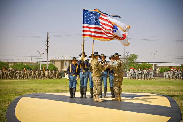 FORT HOOD, Texas- Maj. Gen. Daniel Allyn (left), 1st Cavalry Division commander, and Division Command Sgt. Maj. Isaia Viomoto case the division's colors on Cooper Field's historic Cav patch April 15. The casing signifies the division's movement of...