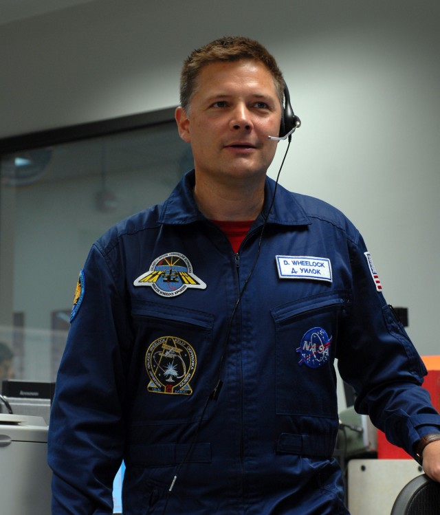 Col. Wheelock Wearing A Blue Russian Space Suit