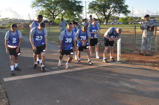 FORT SHAFTER FLATS, Hawaii - Competitors in the 9th Mission Support Command's annual Best Warrior Competition prepare for the two-mile run portion of their Army Physical Fitness Test, here, April 20. The competition is a grueling five-day event,...