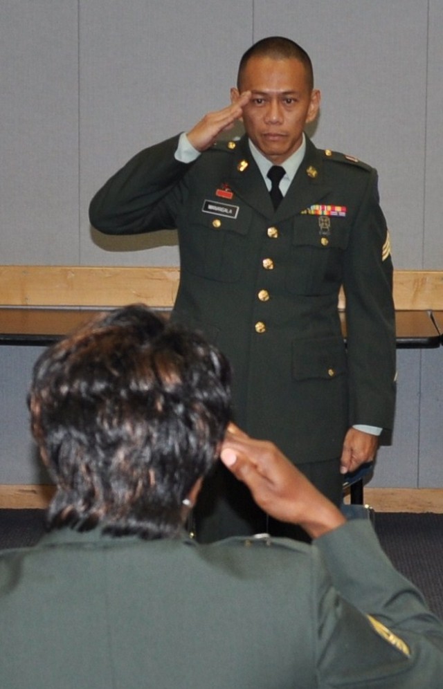 FORT SHAFTER FLATS, Hawaii - Sgt. Gerald Manansala reports to the president of the board at the 9th Mission Support Command's Best Warrior Competition, April 20. In this part of the five-day competition, Manansala, along with eight other top Army...