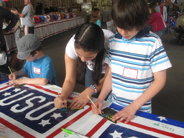 Youth team with USO to sign cards