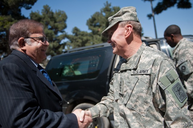 Dempsey greets Wardak