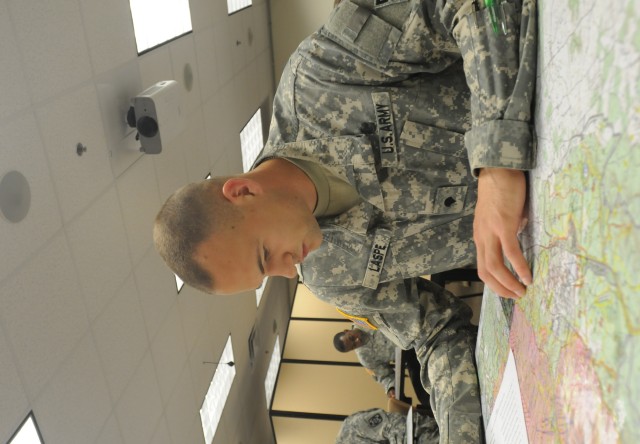 Spc. Brandon Laspe, a diver with the 74th Engineer Dive Team, Special Troops Battalion, 7th Sus. Bde., takes a written test on map reading April 19 during the 3d Sustainment Command (Expeditionary)'s NCO and Soldier of the Year competition. Laspe...