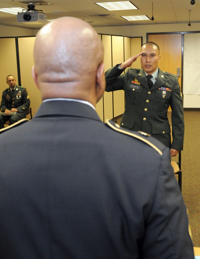 Spc. Jere Cerdenio, a fueler with the 530th Combat Sustainment Support Battalion, reports to the president of the board April 18 during the 3d Sustainment Command (Expeditionary) Noncommissioned Officer and Soldier of the Year competition. The...