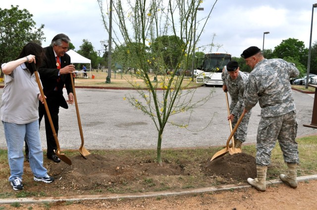 The Hon. Katherine Hammack, Mayor Pro-tem Ray Lopex, Col. Scott Kimmel and Lt. Gen. Rick Lynch dedicate the IMCOM tree, a palo verde, during Earth Day at John James Park.
