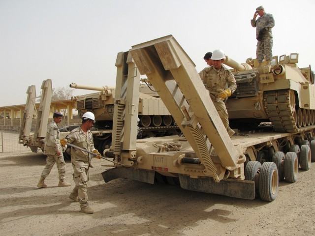 Soldier teach Iraqi Army how to upload, download tanks