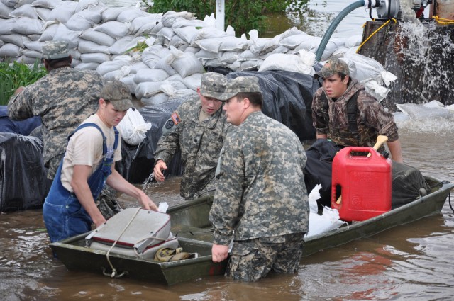Guard members assist flood victim
