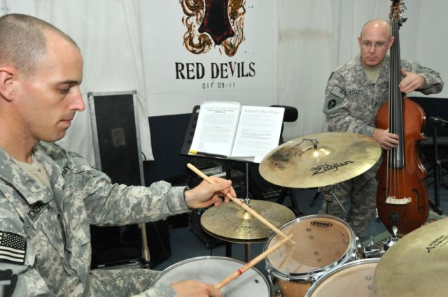 Sgt. Fricker on drums and Staff Sgt. Kelley on bass