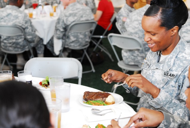 FORT HOOD, Texas - Soldiers begin to cut into her steak as a final test to the 1st Annual Culinary Exhibition completion. The entree' was prepared by 96th Transportation Company here as part of the exhibition.(Photo by Spc.Sharmain T. Burch 14th...