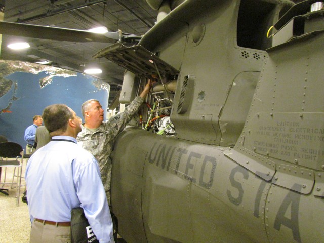 Chief Warrant Officer 4 Shows Off New Engine Parts Of A Crashed OH-58D Kiowa