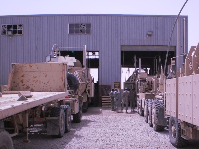 CONTINGENCY OPERATING BASE ADDER, Iraq - Soldiers in the distribution platoon of G Forward Support Company Task Force 2nd Battalion, 82nd Field Artillery Regiment, 3rd Advise and Assist Brigade, 1st Cavalry Division review vehicle dispatches and main...