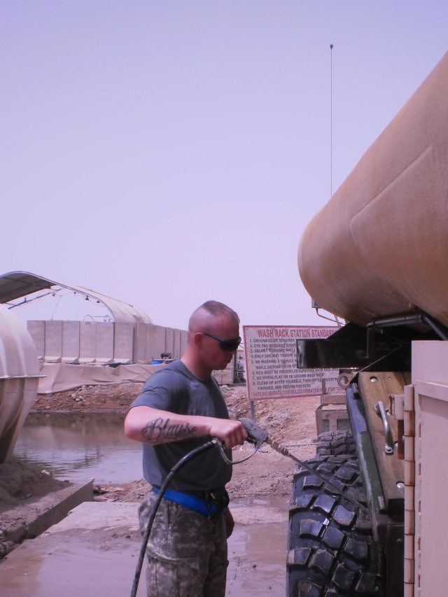 CONTINGENCY OPERATING BASE ADDER, Iraq - Spc. Micaiah Schneider, a driver in the distribution platoon of G Forward Support Company, Task Force 2nd Battalion, 82nd Field Artillery Regiment, 3rd Advise and Assist Brigade, 1st Cavalry Division from Port...