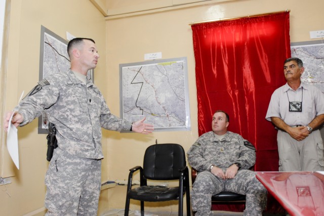 CONTINGENCY OPERATING BASE ADDER, Iraq - Lt. Col. Robert Wright, the commander of 2nd Battalion, 82nd Field Artillery Regiment, 3rd Advise and Assist Brigade, 1st Cavalry Division explains the importance of having a standardized map legend for...
