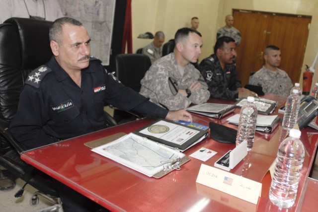 CONTINGENCY OPERATING BASE ADDER, Iraq - Lt. Col. Robert Wright, the commander for 2nd Battalion, 82nd Field Artillery Regiment, 3rd Advise and Assist Brigade, 1st Cavalry Division sits with local police officials during a route security...