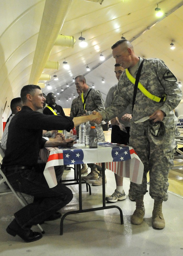 CONTINGENCY OPERATING SITE MAREZ, Iraq - Spc. Matthew Coons, a motor transport operator assigned to Forward Support Company E, 2nd Battalion, 7th Cavalry Regiment, 4th Advise and Assist Brigade, 1st Cavalry Division, thanks Air Force Tech Sgt....