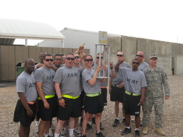 Contingency Operating Base Basrah, Iraq - The ADC Maintenance Platoon hoists the 1st Place Trophy at the company formation that concluded the Alpha Distribution Company, 215th Brigade Support Battalion, 3rd Brigade Combat Team, 1st Cavalry...