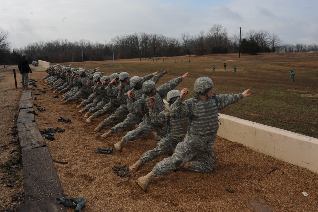 Learning to throw hand grenades over a low wall