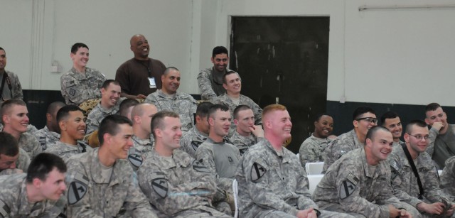 JOINT SECURITY STATION INDIA, Iraq - Soldiers assigned to 2nd Battalion, 7th Cavalry Regiment, 4th Advise and Assist Brigade, 1st Cavalry Division laugh at jokes by comedians during the "Last Comic Standing" tour at Joint Security Station India, Iraq...