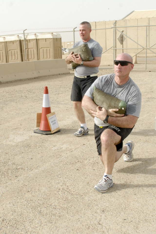 CONTINGENCY OPERATING BASE ADDER, Iraq - Lt. Col. Tim Brumfiel, the commander of 3rd Battalion, 8th Cavalry Regiment, 3rd Advise and Assist Brigade, 1st Cavalry Division conducts weighted lunges during a physical training session for commanders and c...