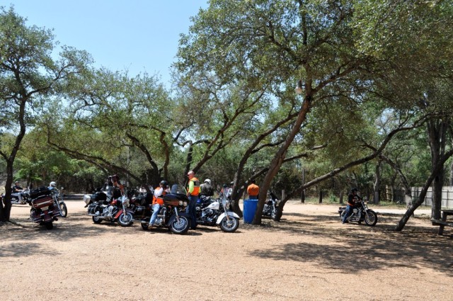 IMCOM motorycle riders rest in the shade after a three-hour ride through the Texas Hill Country. 