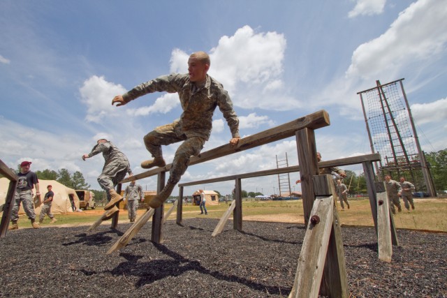 Paratrooper teams assault obstacle course in 2011 All American Week ...