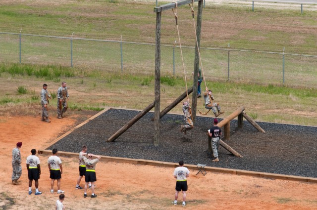 Paratrooper teams assault obstacle course in 2011 All American Week Team Assault Competition