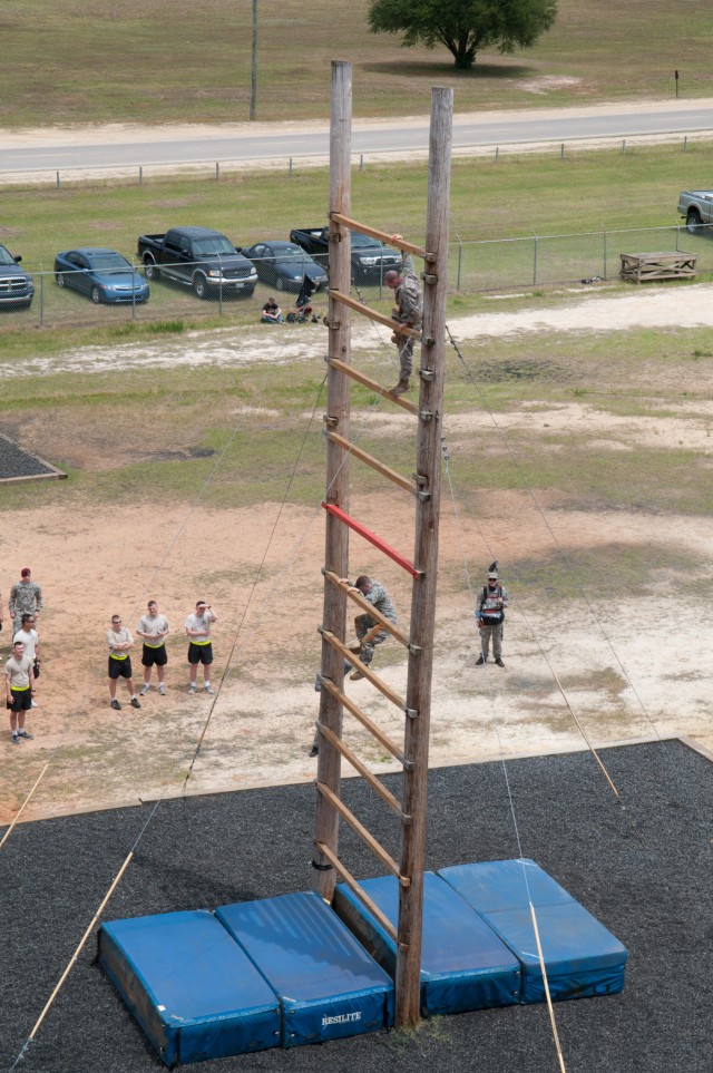 Paratrooper teams assault obstacle course in 2011 All American Week Team Assault Competition