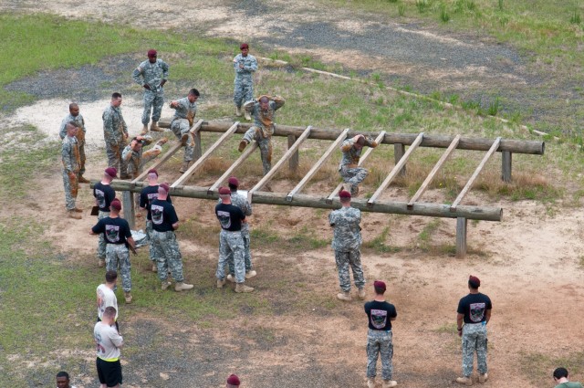 Paratrooper teams assault obstacle course in 2011 All American Week Team Assault Competition