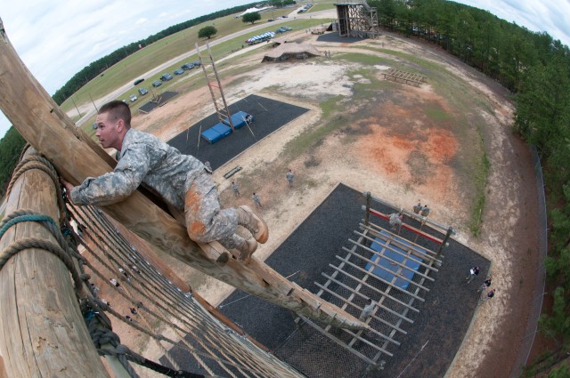 Paratrooper teams assault obstacle course in 2011 All American Week Team Assault Competition