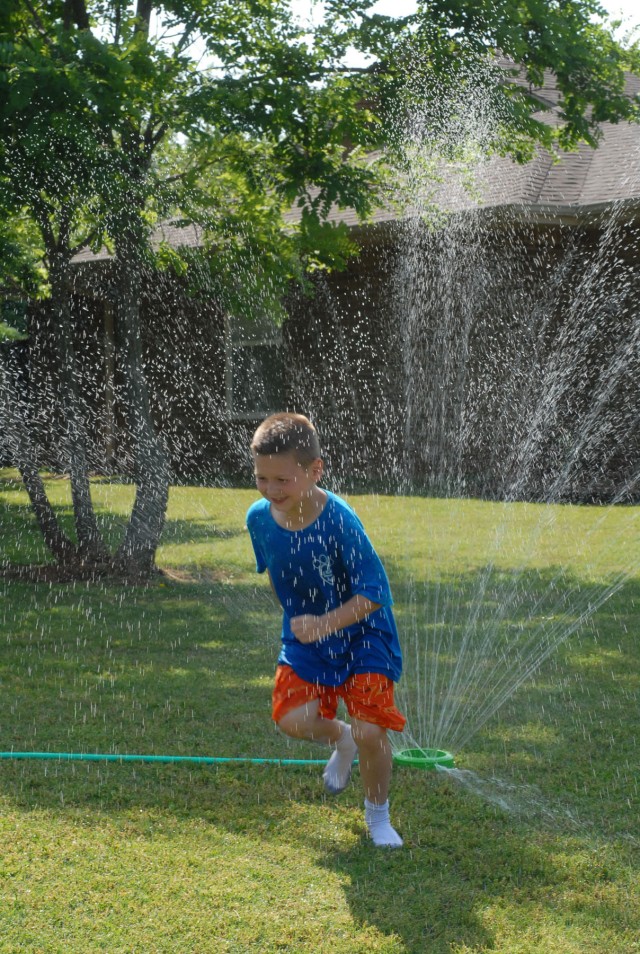 Owen Sonnenberg Runs Through The Sprinkler
