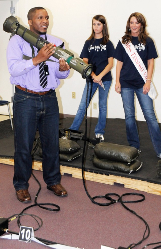 Miss Alabama contestants salute the troops