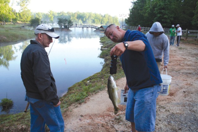 Soldiers select the fishing pole they will use during the 4th annual WTB Fishing Tourney at the Lewis&#039; farm in Thomson, Ga. 