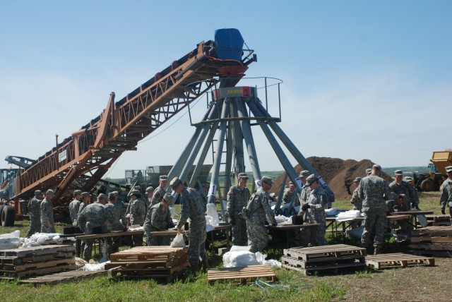 Filling and loading sandbags