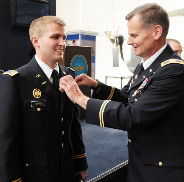 Father gives son his wings during graduation ceremony