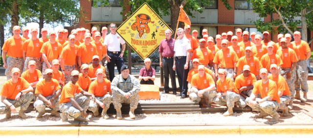 Warrant officer class honors, helps tornado victims