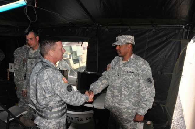 Maj. Gen. Michael J. Terry presents Sgt. 1st Class Michael Williams