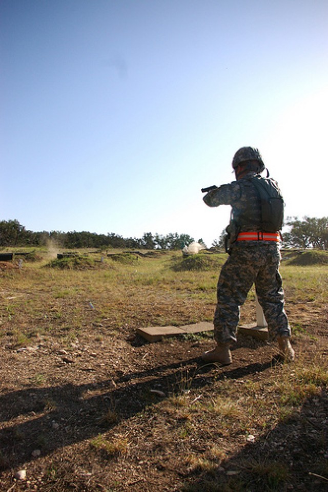 "Mystery Event": Soldiers fire off 9mm's at the combat pistol qualification course on the last day of the Best Warrior Competition
