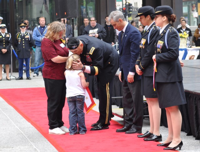 Gen. Odierno kisses girl at Memorial Day Commemoration Ceremony