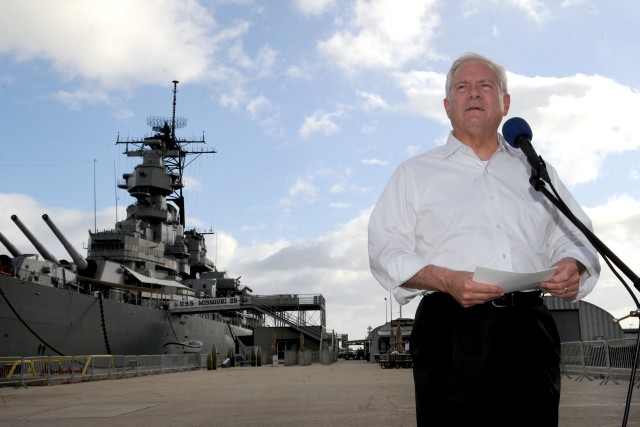 Gates speaks in front of USS Missouri Memorial