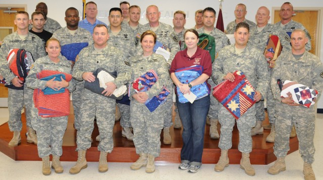 Fort Rucker Soldiers receive quilts from grateful community