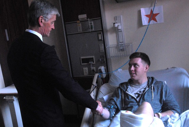 Secretary of the Army visits wounded warrior