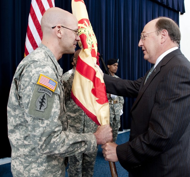 Lt. Col. Frank Sobchak, left accepts the USAG-Natick colors from IMCOM NE Region Director Russ Hall during the USAG-Natick Change of Command ceremony on June 10, 2011.