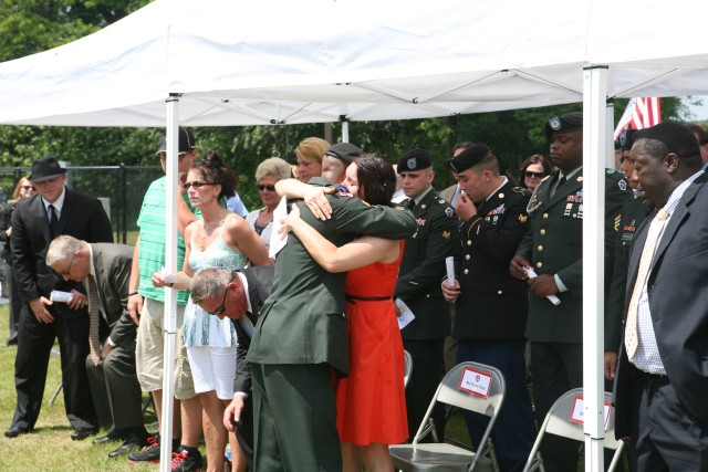 SFC Webster hugs the widow of SSG Tieman