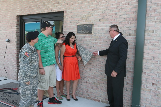 The family unveils the plaque