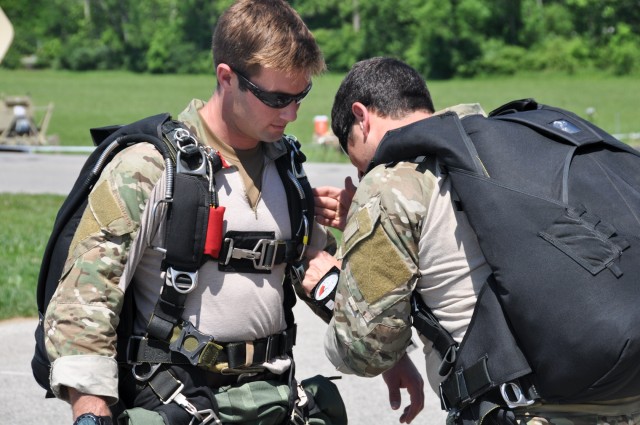 Parachutist checks equipment