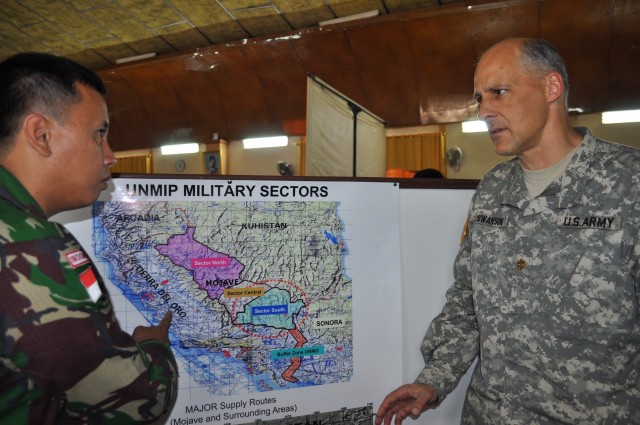 JAG discusses the location of a cordon and search mission administrative officer